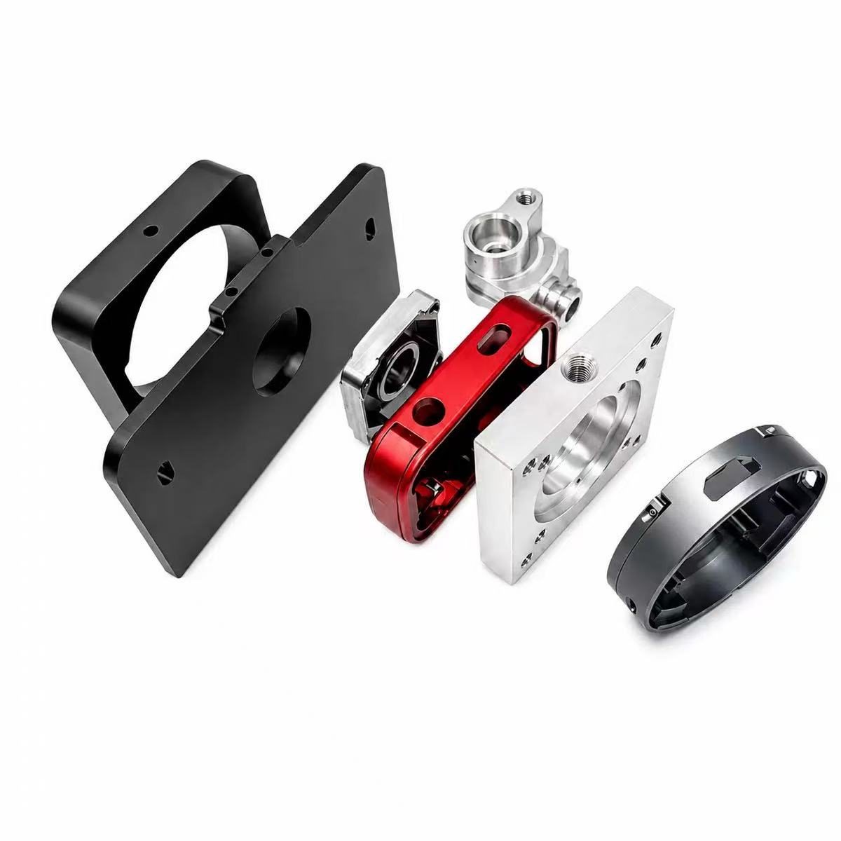 Grid of precision CNC machined aluminium parts — brackets, fittings and housings