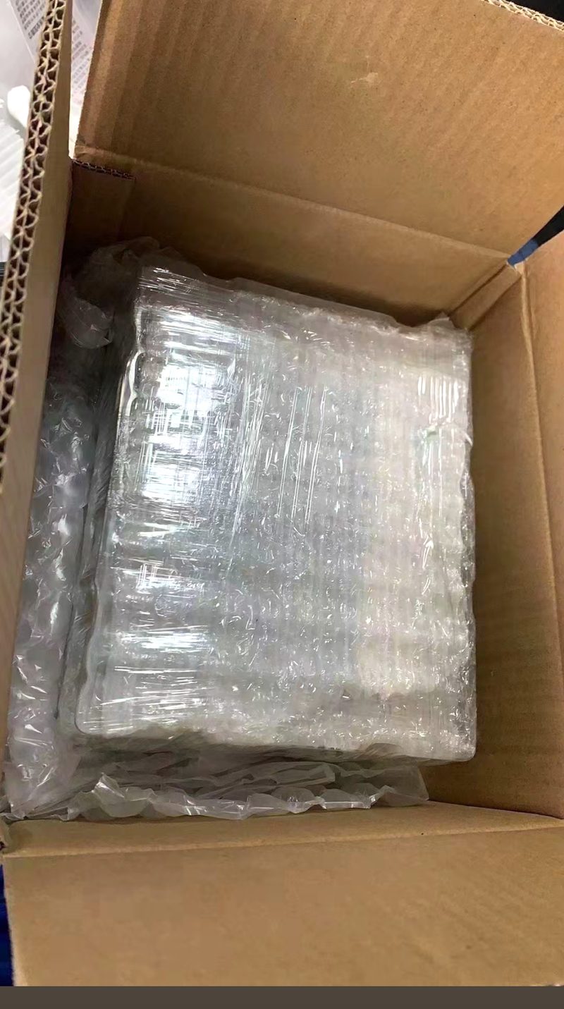 Parts wrapped in bubble wrap inside an export carton