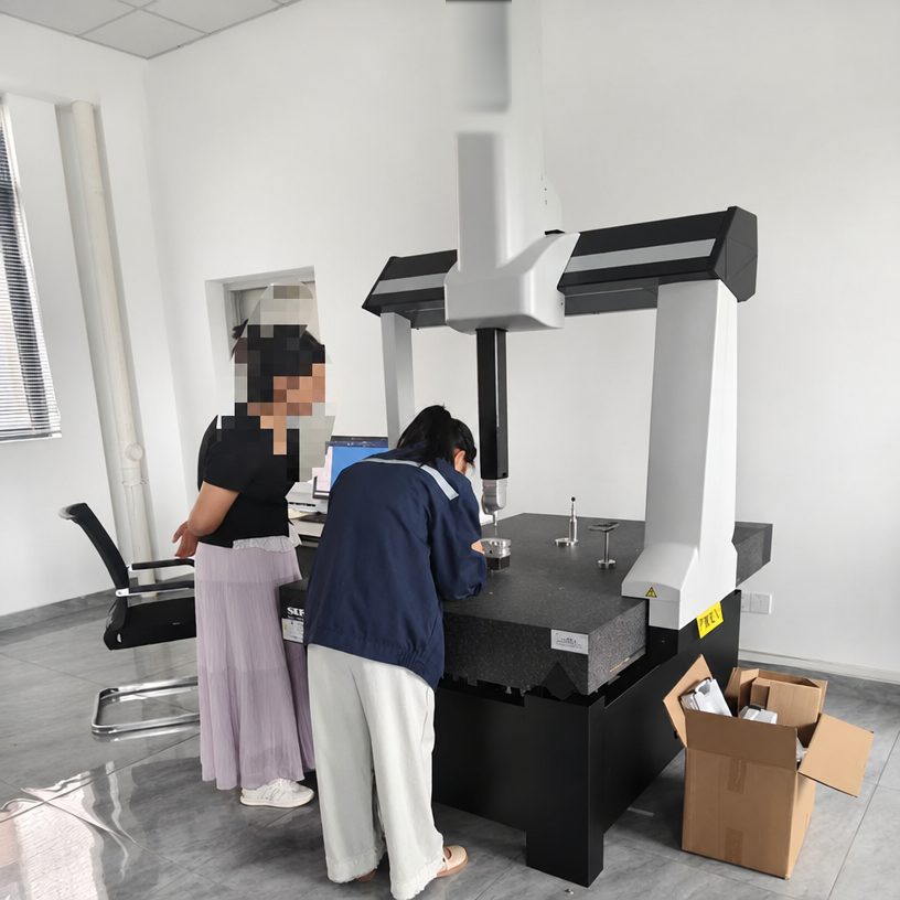 Quality team performing CMM dimensional inspection in our metrology room