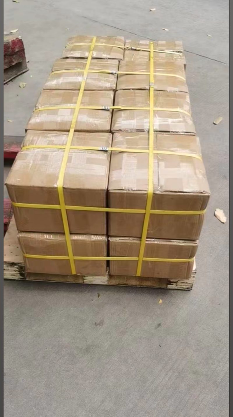 Cartons strapped to a wooden pallet, ready for freight pickup