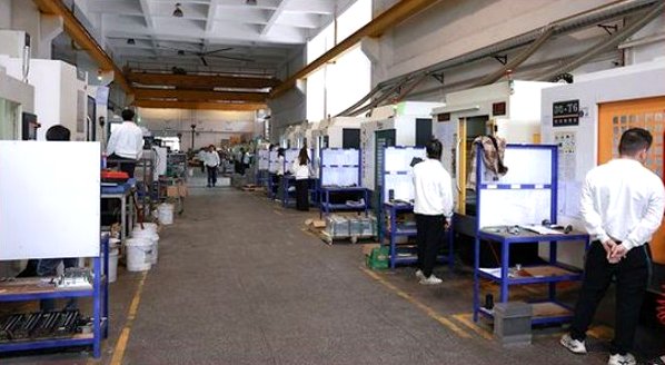 Production floor overview with CNC machines and work benches